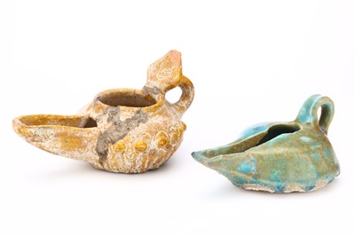 Lot 27 - TWO KASHAN GLAZED CERAMIC OIL LAMPS, one blue...