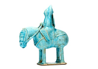 Lot 29 - A TURQUOISE GLAZED CERAMIC FIGURE, of horse...