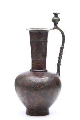 Lot 38 - AN ABBASID BRONZE EWER, having two bands of...