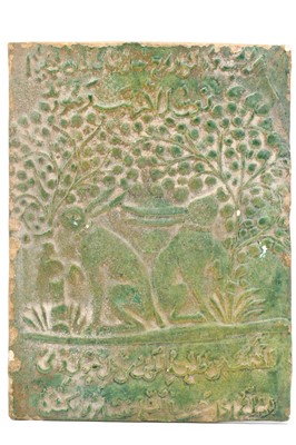 Lot 59 - A RARE GREEN MOULDED CERAMIC TILE, depicting...