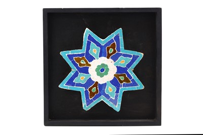 Lot 62 - A SAFAVID STAR SHAPED MOSAIC GLAZED CERAMIC...