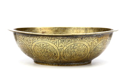 Lot 101 - A PERSIAN QAJAR BRASS MAGIC BOWL, finely...