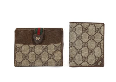 Lot 317 - Two vintage Gucci wallets, monogram canvas and...