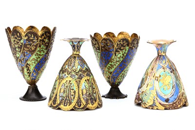 Lot 170 - FOUR OTTOMAN GILT METAL AND ENAMELLED ZARFS....