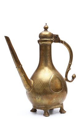 Lot 231 - A NORTH INDIAN MOGHUL BRONZE ENGRAVED EWER....