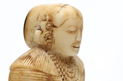 Lot 274 - A FINELY CARVED SRI LANKAN IVORY FIGURE OF A...