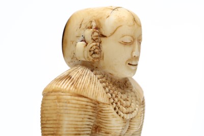 Lot 274 - A FINELY CARVED SRI LANKAN IVORY FIGURE OF A...