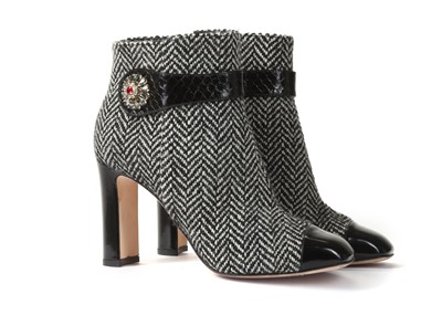 Lot 520 - Dolce and Gabbana black and white heeled boots,...