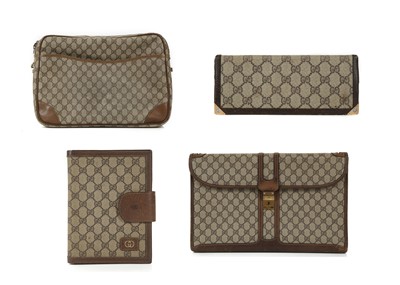 Lot 313 - Gucci monogram items, 1990s, brown coated...