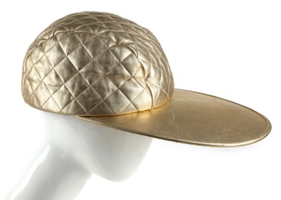 Lot 597 - Chanel Runway gold quilted baseball hat, 1991...