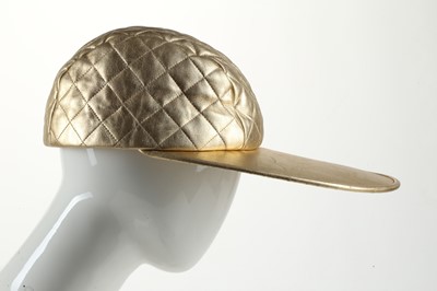 Lot 597 - Chanel Runway gold quilted baseball hat, 1991...