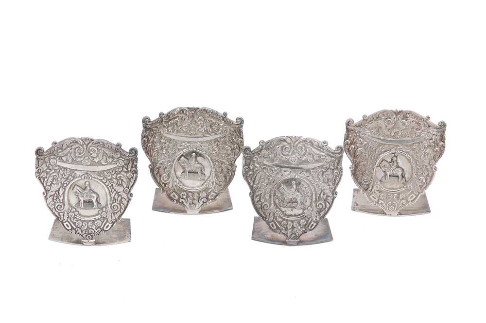 Lot 284 - A set of four Indian Colonial white metal menu...