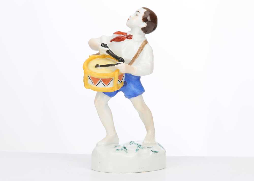 Lot 231 - A RARE RUSSIAN PORCELAIN FIGURE OF 'PIONEER...