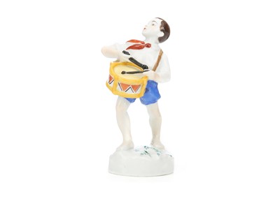 Lot 231 - A RARE RUSSIAN PORCELAIN FIGURE OF 'PIONEER...