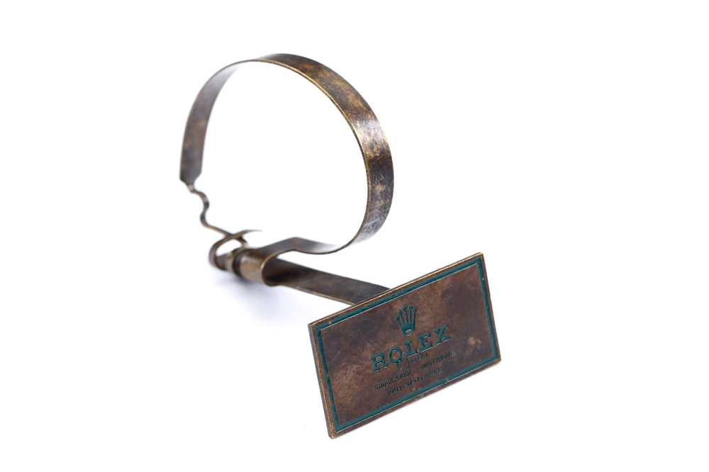 Lot 62 - ROLEX. A 1950'S BRASS WATCH DISPLAY STAND....