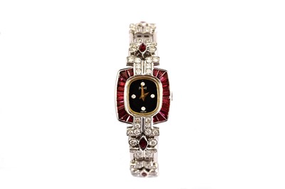 Lot 69 - PIAGET MARRIAGE. AN 18K WHITE GOLD, RUBY AND...