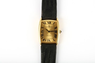 Lot 81 - BAUME & MERCIER. AN 18K GOLD AUTOMATIC...