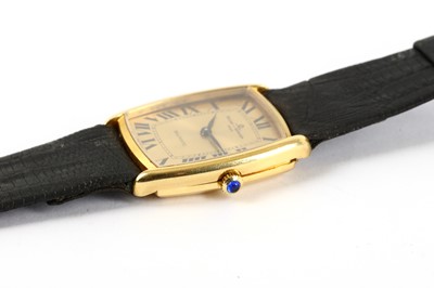 Lot 81 - BAUME & MERCIER. AN 18K GOLD AUTOMATIC...