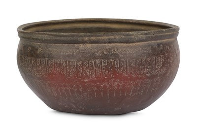 Lot 23 - A LARGE COPPER BOWL WITH KUFIC INSCRIPTIONS...