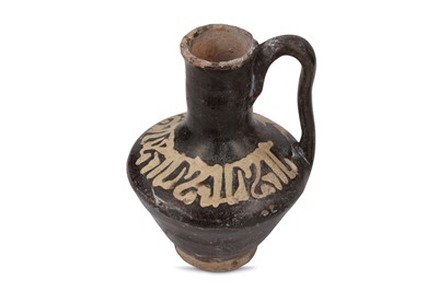 Lot 22 - A BROWN-GLAZED POTTERY JUG Possibly Nishapur,...