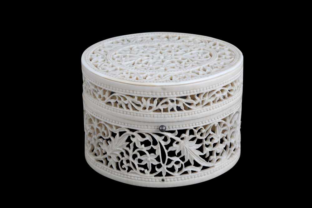 Lot 220 - A CARVED AND PIERCED IVORY BOX India, late...