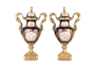 Lot 154 - A PAIR OF LOUIS XV STYLE PORCELAIN AND GILT...