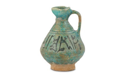 Lot 15 - A TURQUOISE-GLAZED POTTERY JUG WITH...