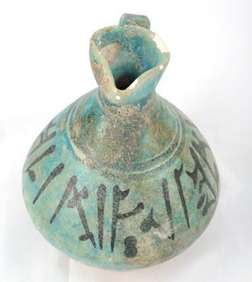 Lot 15 - A TURQUOISE-GLAZED POTTERY JUG WITH...