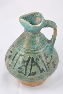 Lot 15 - A TURQUOISE-GLAZED POTTERY JUG WITH...