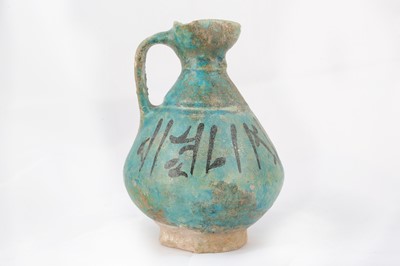 Lot 15 - A TURQUOISE-GLAZED POTTERY JUG WITH...