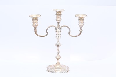 Lot 306 - An Elizabeth II silver three-light candelabrum,...