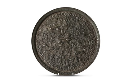 Lot 255 - A MUGHAL BRONZE REPOUSSÉ TRAY India, late 18th...