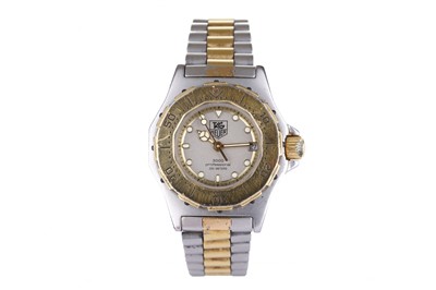 Lot 74 - Tag Heuer. A ladies stainless steel and gold...