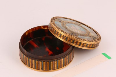 Lot 24 - A Louis XVI gold mounted vernis martin table...