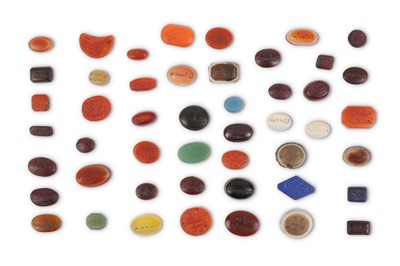 Lot 192 - FORTY-EIGHT HARDSTONE SEALS AND INTAGLIOS...