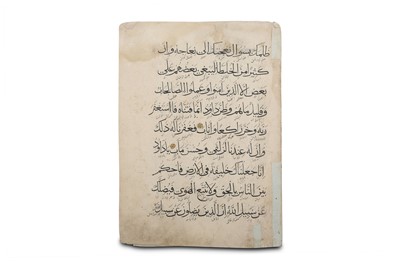 Lot 32 - FOUR LOOSE QUR'ANIC FOLIOS Ilkhanid Iran, 14th...