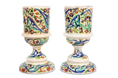 Lot 117 - A PAIR OF KUTAHYA POTTERY CANDLE HOLDERS...