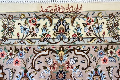 Lot 26 - AN EXTREMELY FINE SIGNED SILK KASHAN CARPET,...