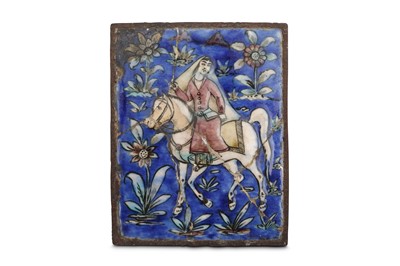 Lot 182 - A QAJAR MOULDED POTTERY TILE Iran, 19th...