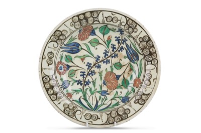 Lot 77 - AN IZNIK POTTERY DISH Ottoman Turkey, 17th...