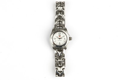 Lot 388 - Tag Heuer. A stainless steel quartz calendar...