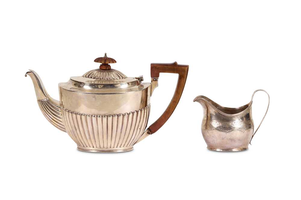 Lot 305 - An Edwardian antique sterling silver teapot,...