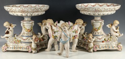 Lot 387 - A pair of porcelain tazzas having figural...