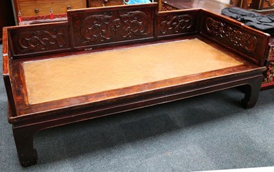 Lot 404 - A Chinese hardwood bed with basket woven base,...