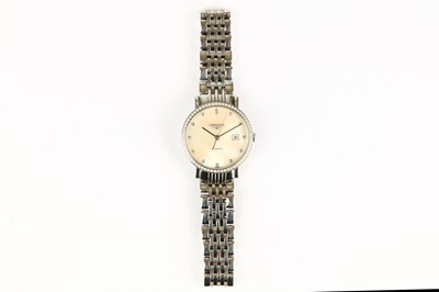 Lot 384 - Longines. A stainless steel automatic calendar...