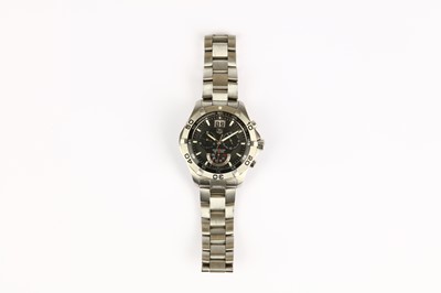 Lot 351 - Tag Heuer. A stainless steel quartz calendar...