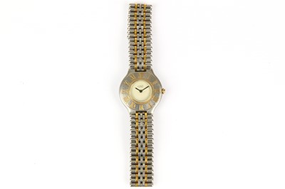 Lot 389 - Cartier. A stainless steel and gold quartz...