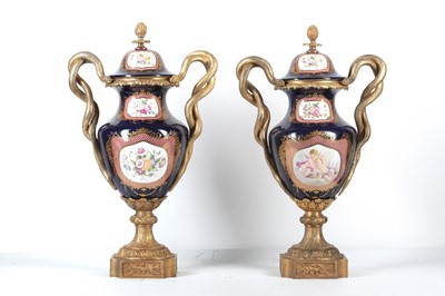 Lot 137 - A PAIR OF LOUIS XV STYLE PORCELAIN AND GILT...