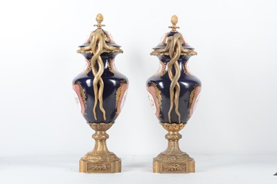 Lot 137 - A PAIR OF LOUIS XV STYLE PORCELAIN AND GILT...
