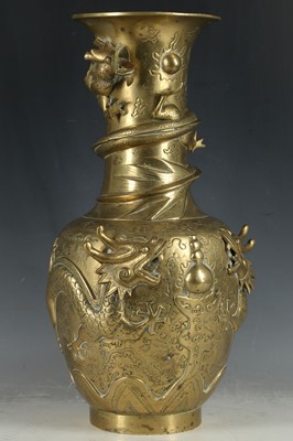 Lot 391 - A Chinese brass vase decorated in high relief...